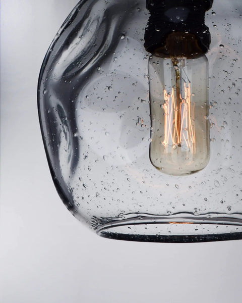 Close-up of glass bulb in Two Pack Pendant Lights Art Glass Snowflake Design For Kitchen Island And Bedroom Nook, Clear Seeded Bubble Glass