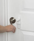 OutSmart Lever Handle Lock 4 Pack White Kid Safe Kidproof Lock For Lever Handles With Hidden Buttons And Decoy Button on white door