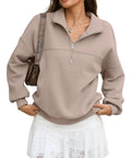 Woman wearing a cozy oversized women quarter zip fleece sweatshirt with half zip collared long sleeve pullover for fall and winter