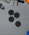 Premium Umbrella Diameter Thread Repair Kit For 6mm Frames Includes 8 Black Plastic Convex End Caps With Smooth Edges And Polished Finish Perfect For Patio Home Garden Upgrades. Black 6mm plastic umbrella end caps shown on a gray work surface