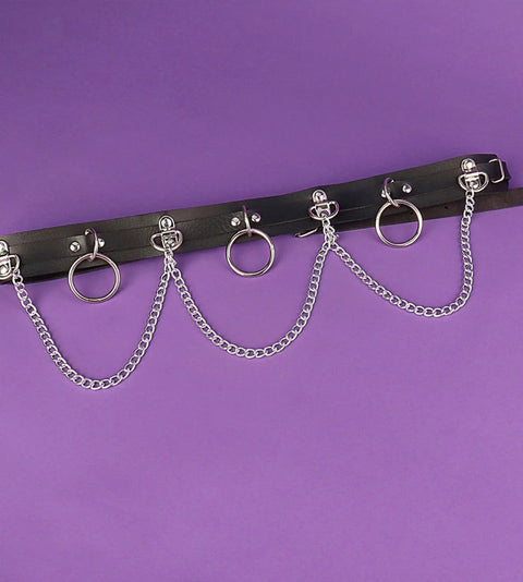 Premium Punk Belt With Chain For Women Adjustable Leather Body Chain Gothic Accessory with silver rings and chains on purple background.