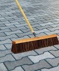 Heavy Duty 18 Inch Palmyra Bristle Push Broom For Garage Indoor Floor Sweep on patio pavers for easy debris cleanup.