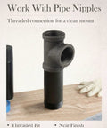 10 Pack Three Quarter Inch Malleable Cast Iron Pipe Tees for Threaded Black Pipes and Fittings on wooden table