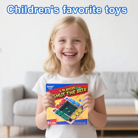 Child holding Shut The Box Dice Game Wooden Board Game For 2 To 4 Players, showing colorful packaging, indoors, smiling.