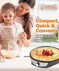 Mother and daughter cooking with 12 Inch Electric Crepe Maker with Nonstick Surface on countertop, crepe with strawberries on top.