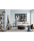 Living room setup featuring Built Different Heavy Duty Black Iron Bookshelf With Real Wood Shelves and modern decor.