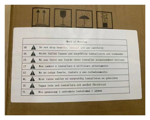 Brown cardboard tool box with a white multilingual warning label on top showing warning icons and text.