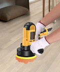 Hands using Variable Speed Buffer Polisher Kit With Removable Handle For Cars, Furniture, Floors, And Stones on wood floor.