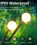 Solar Swaying Firefly Garden Lights With Flexible Copper Wire Outdoor Landscape Stake Lights Two Pack in rain