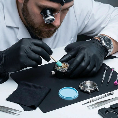 Watchmaker using 13 Piece Watch Repair And Cleaning Kit With 10 Willow Sticks And 2 Pieces Watchmaker Cleaning Clay on wristwatch