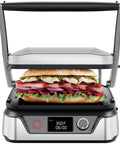 Chefman 5-in-1 Digital Panini Press Grill And Sandwich Maker with a club sandwich inside, displaying temperature and timer.
