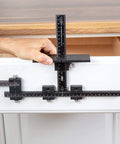 Hand using Rapid Center Extension For Extending End Stop Reach In Cabinet Hardware Installations On Oversized Drawer Fronts, fitting TP jigs