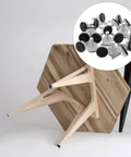 Adjustable M10 Furniture Leveling Feet Set With ABS And Iron Inserts 30 Pack on a wooden table leg