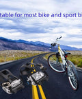 Toe Clips With Straps For Universal Bike Pedals Plastic Pedal Foot Covers for MTB and Road Bikes on a scenic road.