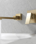 Gold wall mount tub filler with single handle and waterfall spout, modern bathroom fixture.