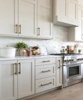 Antique Brass Cabinet Pulls 5 Inch 128mm, 10 Pack Kitchen Cabinet Handles in modern white kitchen setting