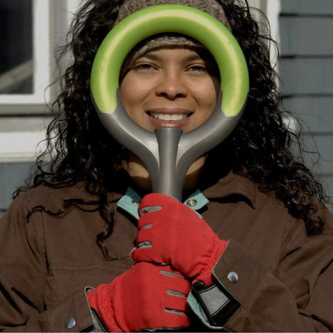Woman holding 202 Pro Ergonomic Stainless Steel Shovel With Round Point Blade For Clay And Rocky Soil in Original Green handle.