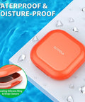 Portable 4 Compartment Pill Organizer Mini Travel Pill Box waterproof, orange case on wet surface, sealing silicone ring detail.