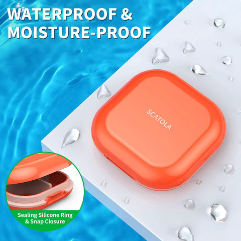 Portable 4 Compartment Pill Organizer Mini Travel Pill Box waterproof, orange case on wet surface, sealing silicone ring detail.