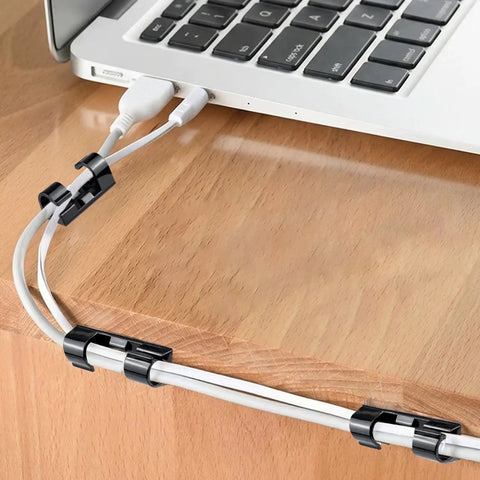 50 Piece Self Adhesive Cable Management Clips Set For TV PC Laptop And Ethernet Cables shown organizing laptop cords on desk