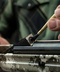 Using brush from Airgun Maintenance And Cleaning Kit With Silicone Lubricant And Portable Case Comprehensive Cleaning Tools kit on rifle