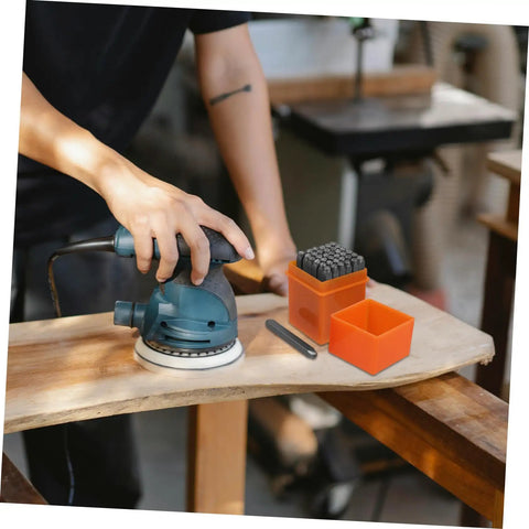 Dope 37 Piece Metal Stamping Kit with letter, number punches and a sander on wooden surface for DIY and crafting projects.