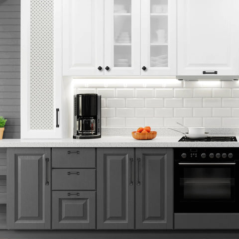 Modern kitchen with 30 Pack 5 Inch Center Black Matte Cabinet Pulls Arch Style Drawer Handles on gray and white cabinets.