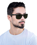 Person wearing RB4165 Justin Classic Square Sunglasses 55mm Black Nylon Frames with Green Classic Lenses Unisex Shades
