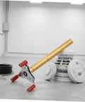 Slick Aluminum Smoke Sensor Removal Tool For Ceilings Universal Fire Alarm Disassembly Grip with red grips beside smoke detector.