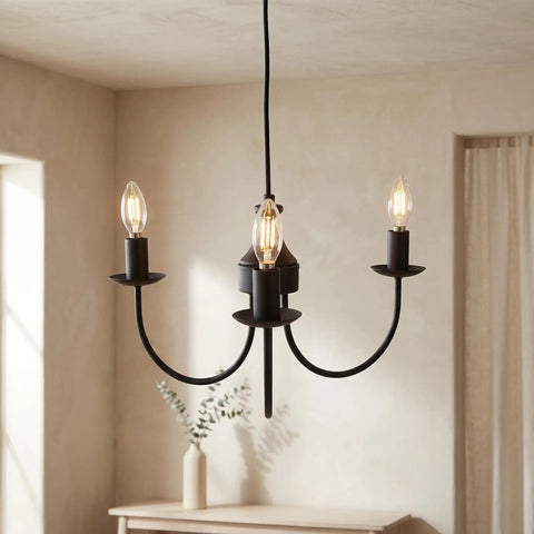 Creative Co-Op Iron & Rubber Wood Pendant Lamp with Golden Glow, featuring three candle-style bulbs and a matte black finish.