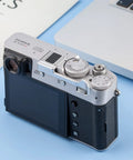 Deluxe Metal Thumb Up Grip For Fuji X100V X100F X-E4 X-E3 Cameras attached to Fujifilm X100V, top view showcasing controls.