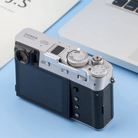 Deluxe Metal Thumb Up Grip For Fuji X100V X100F X-E4 X-E3 Cameras attached to Fujifilm X100V, top view showcasing controls.