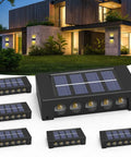 Six Pack Solar Outdoor Lights With 10 LED Waterproof Dusk To Dawn Fence Wall Deck Step Lighting Garden Pathway Yard Patio Warm White Glow For Outdoor Spaces showcasing installed lights in a garden setting with close-up of solar panels.