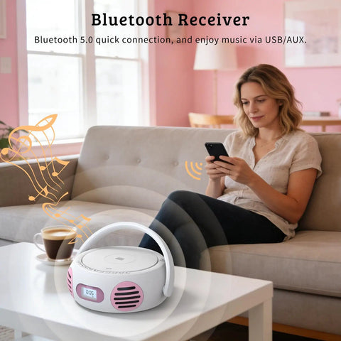 All In One Portable Boombox CD Player With Bluetooth for home use on a coffee table next to a woman using a smartphone.