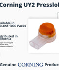 Close-up of Corning UY2 Presslok splice terminal with orange cap and white housing