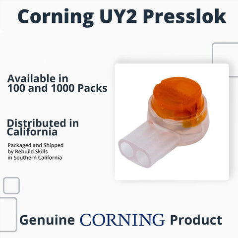 Close-up of Corning UY2 Presslok splice terminal with orange cap and white housing
