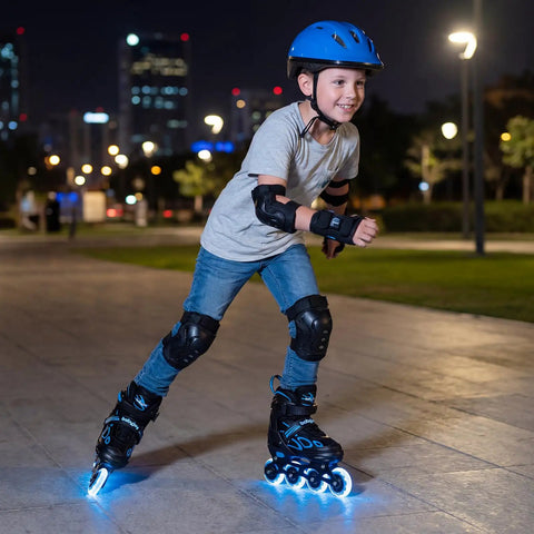 Boy skating at night wearing Adjustable Kids Inline Skates With Four Size Settings And Bright Light Up Wheels For Boys And Girls
