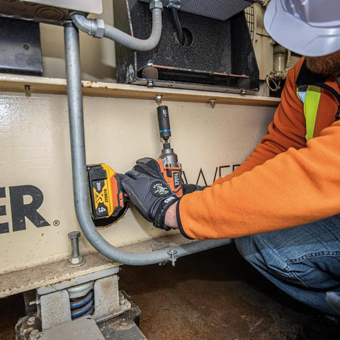 Worker using a Two In One Impact Socket With Hands Free Size Swap, Deep 12 Point, Coaxial Spring Loaded on machinery.