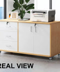 Front view of wooden storage cabinet on four caster wheels with white drawers and doors.