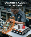 Man operating 30Kg Digital Counting Scale With 0.1g Precision, Battery Powered Industrial Scale for small parts and tickets