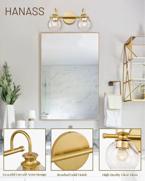 Gold Finish 15 Inch Two Light Vanity Light With Clear Globe Glass Shades Dope Modern Steel Bath Fixture installed over mirror