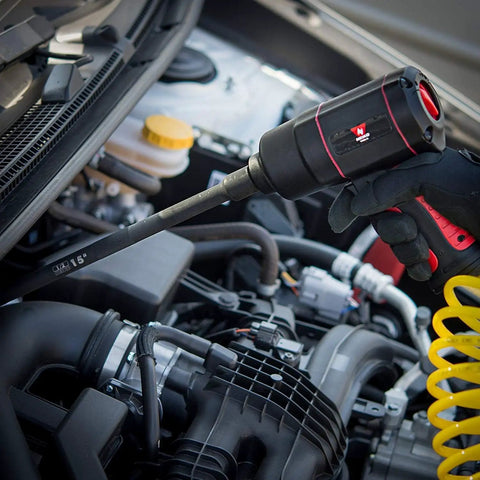 Beefy 1/2-Inch Drive Impact Extension Bar And Adapter Set in use on car engine, shown with universal joint adapter, for repairs