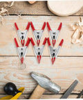 12 Pack Heavy Duty Metal Spring Clamps Kit For Woodworking Pros And DIY Gurus Offering Insane Grip Power For Crafts Dress Fitting Garlands And Household Projects You Need Right Now red metal spring clamps on wooden workbench