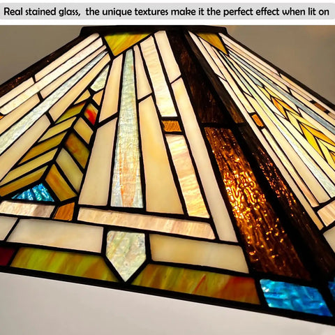 Close-up of Tiffany Style Stained Glass Pendant Light Fixture showcasing intricate mission antique design with warm glow.