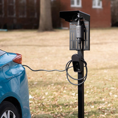 Ride-Ready Outdoor EV Charging Pedestal Housing a Tough Steel Hood Shielding Plug-In connected to a blue car.