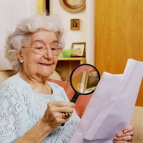 Senior using Handheld 10X Reading Magnifier With 75mm Shatterproof Lens Non Slip Grip Ideal For Seniors And Close Work