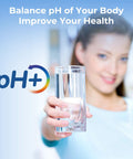 Woman holding glass of water with pH+ symbol, promoting Alkaline Water Filter Replacement For Your Go To Rechargeable Electric Pitcher.
