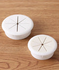 20 Pack Heavy Duty Desk Cable Grommets Kit For Cord Hole Covers With Flexible Rubber Inner Rings To Keep Wires Neat And Secure At Workstations. White plastic cable grommets on wood desk, 50mm
