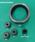 Planetary Gearbox Transfer Case And Short Drive Shaft Skid Plate Front Motor Mount Upgrade Kit gears on green background