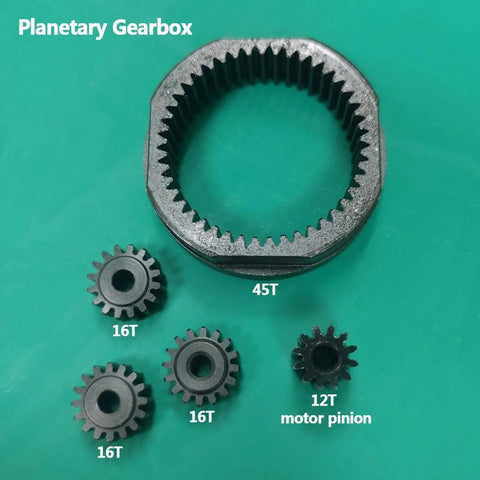 Planetary Gearbox Transfer Case And Short Drive Shaft Skid Plate Front Motor Mount Upgrade Kit gears on green background